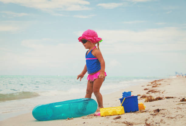 istock little girl going to swim at beach 684955000