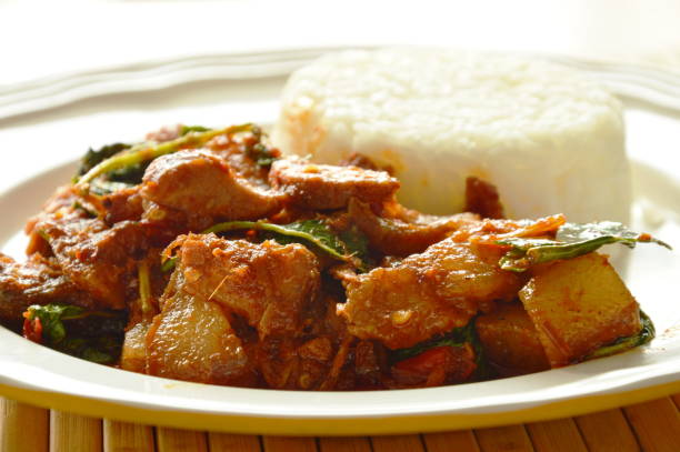 istock spicy stir fried grilled pork curry herb with rice 684955126