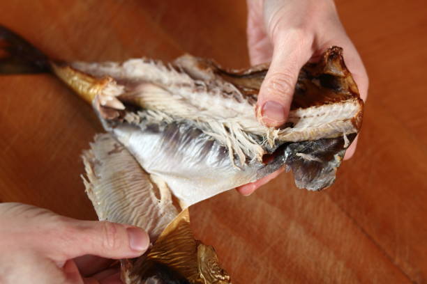istock Removing skin and bones from smoked mackerel 684955464