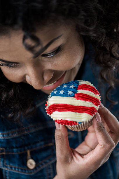 istock girl with american flag cupcake 684961582