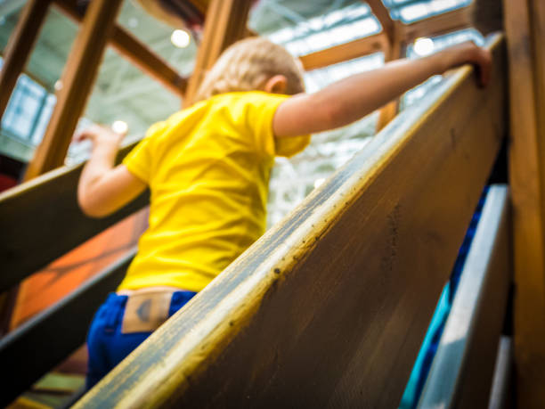 istock The boy climbs the wooden staircase 684963778