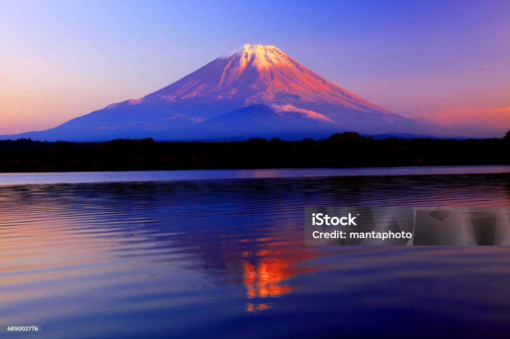 Mt Fuji Japan Mountain Fuji at winter morning with reflection on the lake Kawaguchi, Japan Mt. Fuji Stock Photo