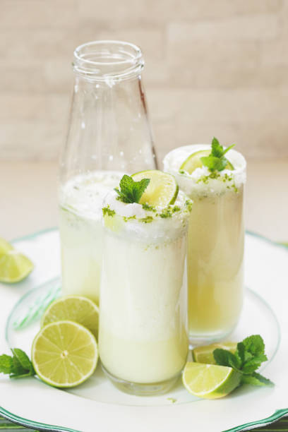 istock Brazilian lemonade or limeade in retro bottle and glasses 685005926