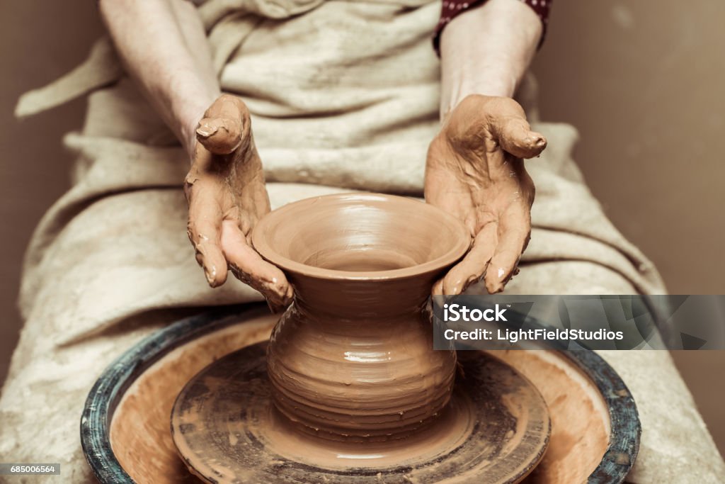 Close up of female hands working on potters wheel Pottery Stock Photo
