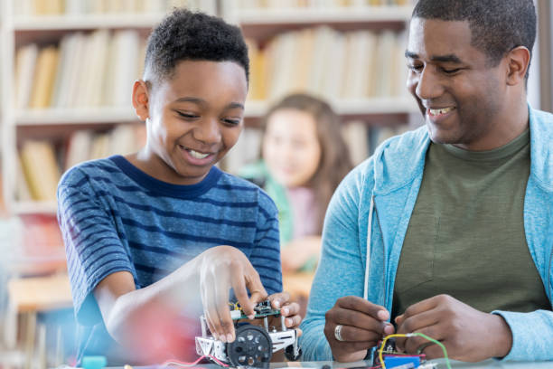 istock Boy enjoys building robotic vehicle 685014350