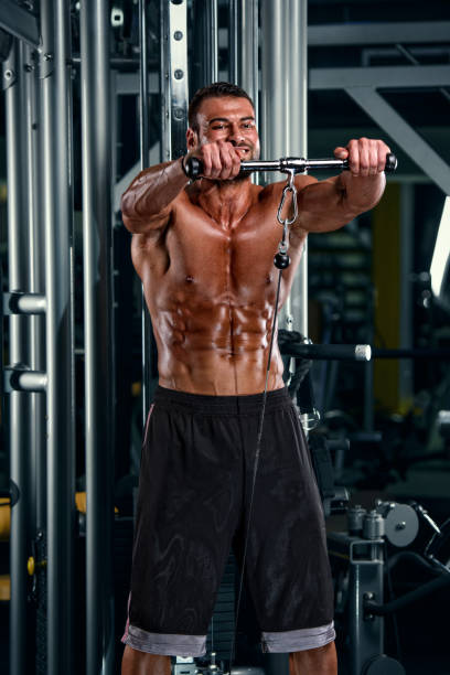 istock Handsome Athletic Men Exercise in the Gym 685015272