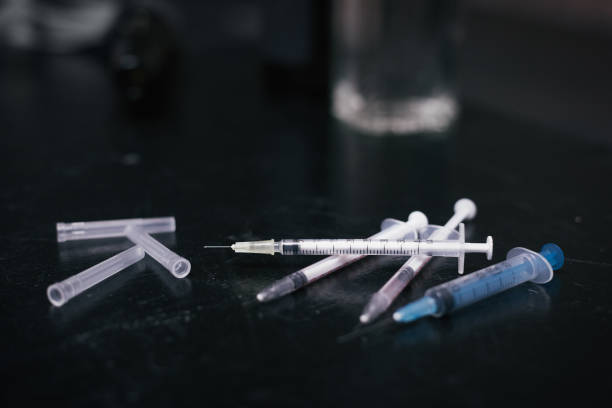 istock Infected syringes lying in the drug den 685016294