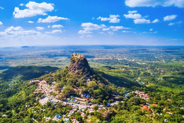 Aerial view of Mount Popa and the sacred Popa Taungkalat monastery, an important pilgrimage site and the favoured home of 37 Nats (aminist spirit entities), near Bagan, Myanmar (Burma).