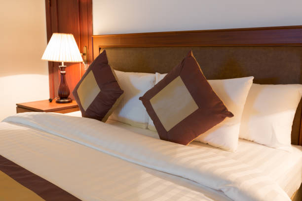 istock Double bed in bedroom with lamp turn on 685019152
