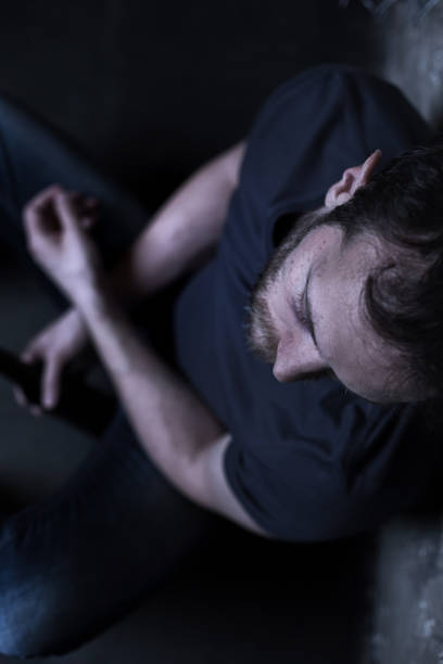 istock Lonely alcoholic drinking alcohol in the darkness 685021566