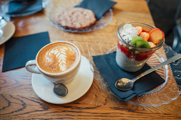 istock Cappuccino with spoon in cup and dessert 685024952