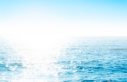 Small white and blue speedboat in motion on the Mediterranean Sea (Ligurian Sea) in front of the rocky coast of the Cinque Terre National Park, UNESCO world heritage site, Ligurian Sea, La Spezia, Liguria, Italy, Europe.