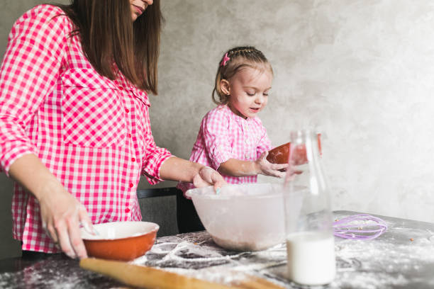 istock Mom and daughter together in the kitchen 685043334