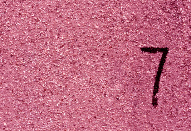 istock Number seven on pink grunge wall surface. 685044042