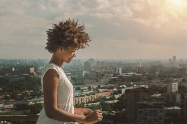 istock Beautiful smiling black girl on balcony 685046736