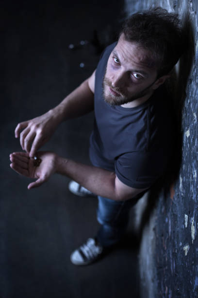 istock Mad drug user holding marijuana cigarette outdoors 685053700