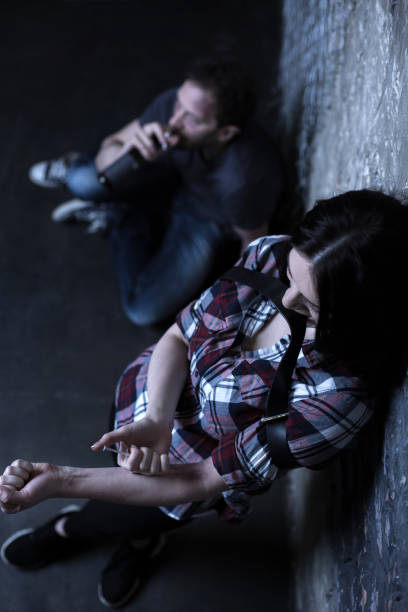 istock Involved young junkies using drugs outdoors 685054056