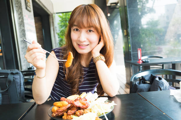 istock Young woman eating breakfast 685057330