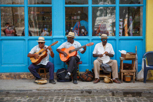 Street musicians in Havana Havana, Cuba - March 24, 2017: Elderly street musicians playing traditional cuban music on the street in old Havana. musical equipment photos stock pictures, royalty-free photos & images