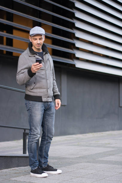 istock Man using smart phone in the city 685063368