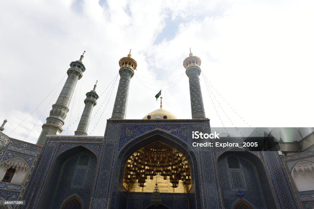 The shrine of Fatima Almasomh The shrine of Fatima Almasomh. It is the shrine to the Shiite sect and is located in the city of Qom. And contains a huge golden dome and a number of minarets aureus and the huge doors. Architectural Dome Stock Photo