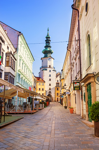 Stock photograph of an alley with stores and restaurants in old town Bratislava, Slovakia.