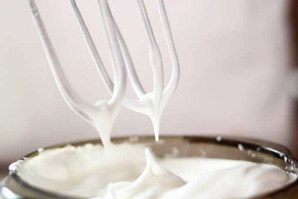 istock White egg peaks. Making frozen strawberry cheesecake series. 685091600