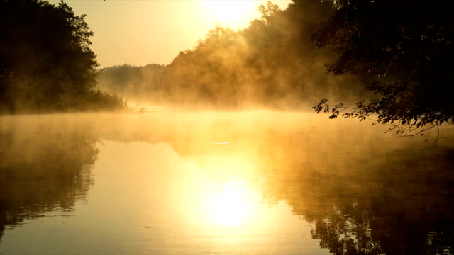 Morning fog on a calm river, sepia toned