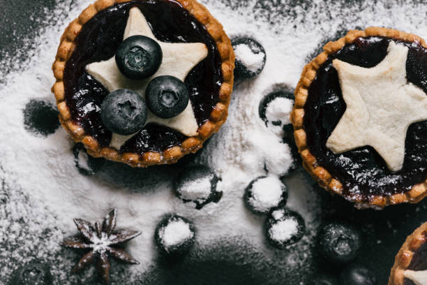 istock Tartalets filled with jam, whole blueberries and sugar powder 685094546