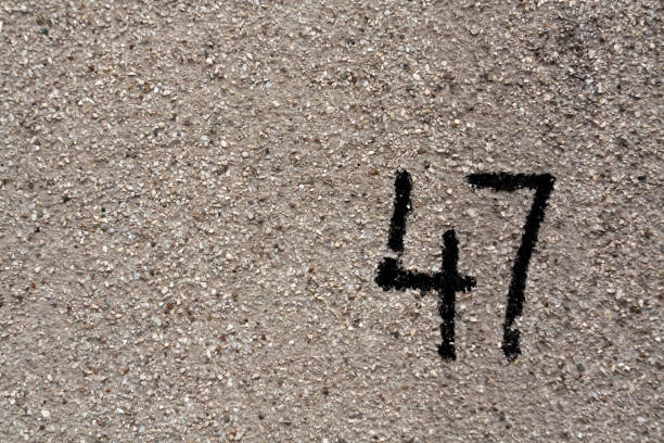 istock number fourty seven on gray plaster wall. 685115180