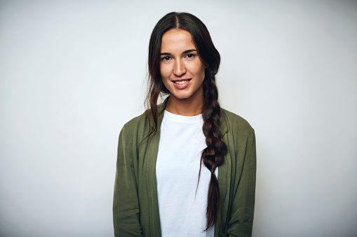 Businesswoman with braided hair over white photo