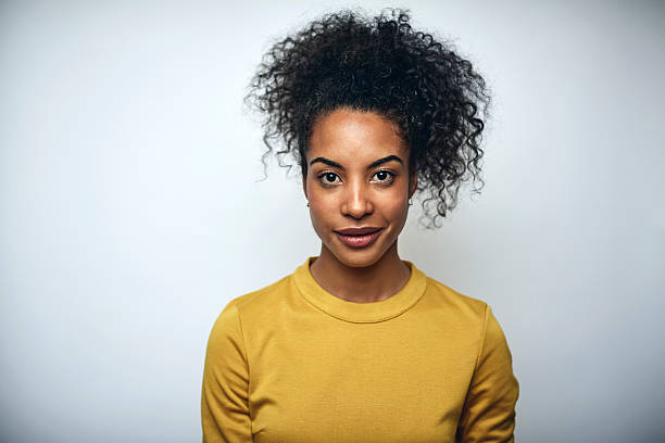 businesswoman with curly hair over white - cool business looking at camera posing fotografías e imágenes de stock