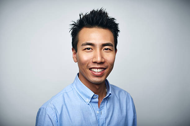 businessman smiling over white background - cool business looking at camera posing fotografías e imágenes de stock