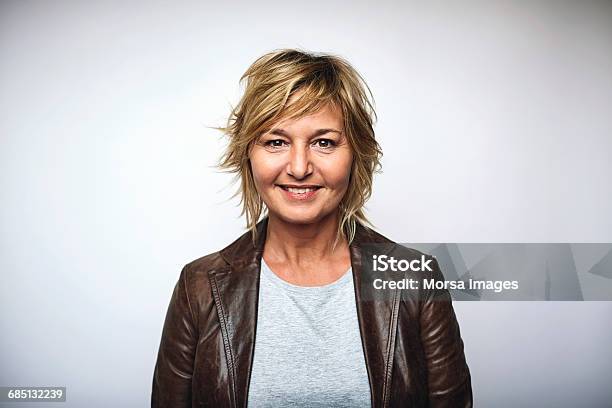 Businesswoman Wearing Leather Jacket Over White Stock Photo - Download Image Now - Portrait, Women, One Woman Only