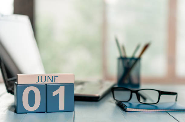 June 1st. Day of the month 1 , wooden color calendar on business workplace background. Summer concept. Empty space for text June 1st. Day of the month 1 , wooden color calendar on business workplace background. Summer concept. Empty space for text. june 1 stock pictures, royalty-free photos & images