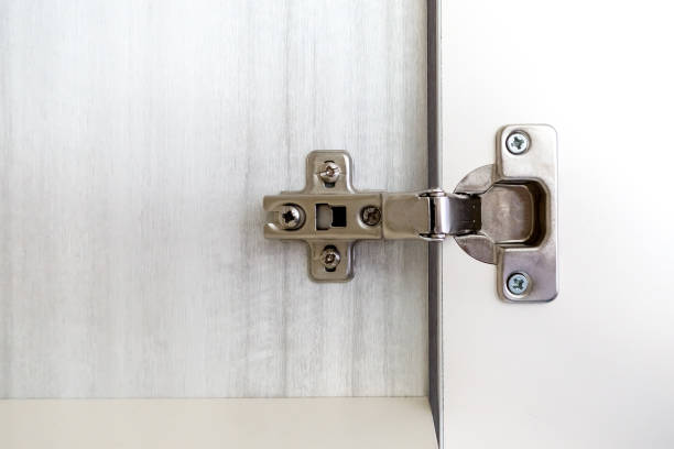 istock Repairman install cabinet hinge 685135762