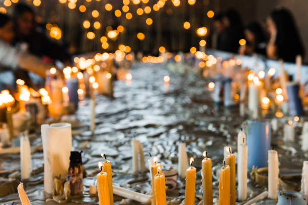 Aparecida, São Paulo, Brazil - July 28, 2013: Candles in Hall of Miracles or Sala dos Milagres in Satuary of Aparecida. The Basilica of the National Shrine of Our Lady Aparecida or Basílica do Santuário Nacional de Nossa Senhora Aparecida is a prominent Roman Rite Catholic Basilica.  It is the second largest church in the world, after St. Peter's Basilica in Vatican City.