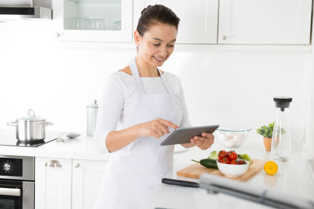 istock Caucasian woman using digital tablet for recipe 685146782