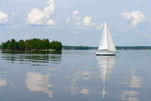 istock Sailboats floating in blue lake in summer. 685147344