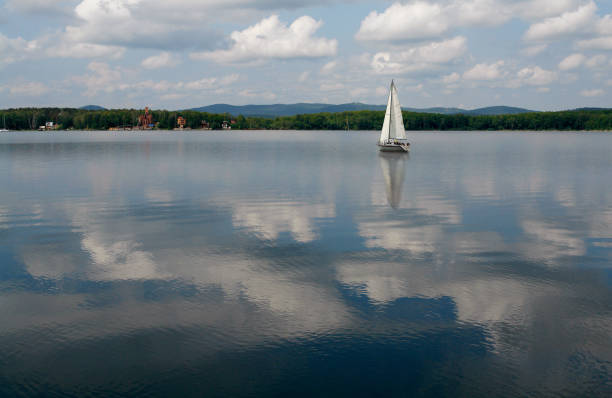 istock Sailboats floating in blue lake in summer. 685164850