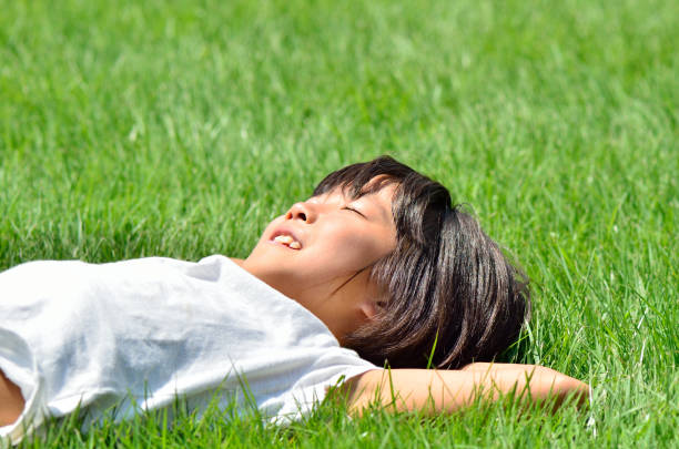 istock Girl taking a break in the lawn square 685165662