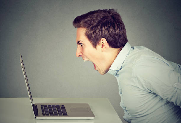 istock angry man working on the laptop screaming 685166664