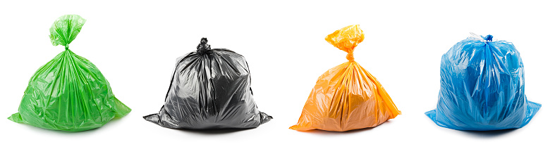 A set of colored garbage bags isolated on white background. Collage of garbage bags.