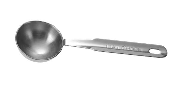 colher de sopa de colher de medição de metal. isolado em fundo branco. - table spoon - fotografias e filmes do acervo