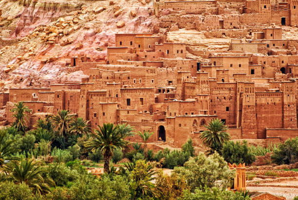 Ait Benhaddou clay kasbah town, Morocco Ait Benhaddou is a clay fortified city, ksar, along the caravan route between Sahara and Marrakech, Morocco. It's a popular film location and UNESCO World Culture Heritage Site. ait benhaddou stock pictures, royalty-free photos & images