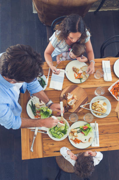 istock Family eating a meal at the table. 685238952