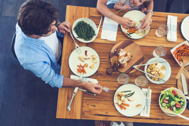 istock Family eating a meal at the table. 685238960