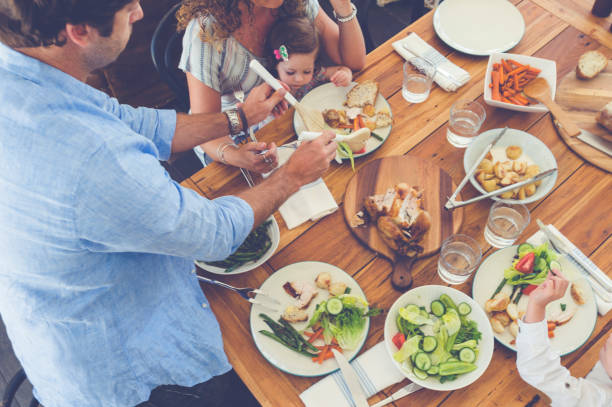 istock Family eating a meal at the table. 685238980