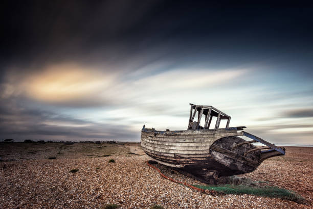 istock Single boat stranded on pebbled beach. Dungeness, England 685244196