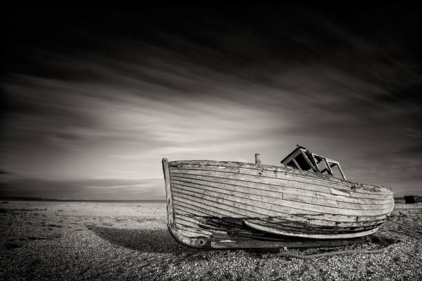istock Single boat stranded on pebbled beach. Dungeness, England 685244256